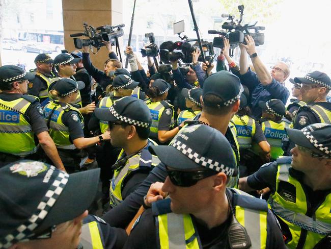 A heavy police presence is seen outside the Melbourne Magistrates' Court as it was confirmed George Pell will stand trial. Picture: Darrian Traynor/Getty Images