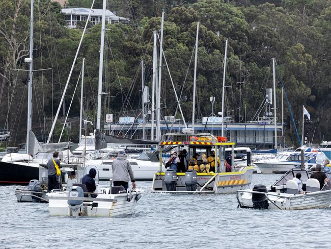 A flotilla of boats carrying friends and neighbours accompanied Susan Duncan’s body on her final journey back to the mainland.