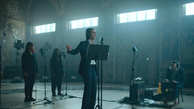 Nick Cave (centre) performing in London in March 2021, in a still shot from the Andrew Dominik film This Much I Know To Be True, released in 2022. Picture: Supplied / Bad Seed Ltd