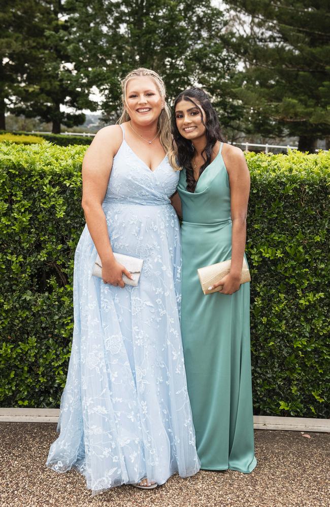 Chloe Ives (left) and Sara Chandran at Centenary Heights State High School formal at Picnic Point, Friday, November 15, 2024. Picture: Kevin Farmer