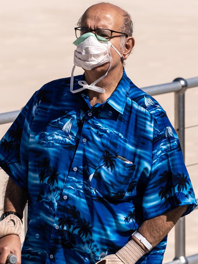 A man wearing a protective face mask in Sydney. Picture: James Gourley