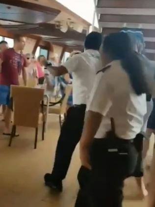 Carnival staff argue with passengers. Picture: 3AW.