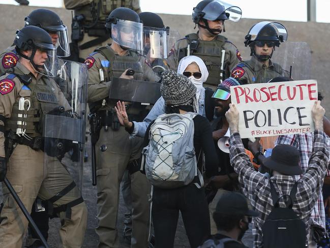 Texas State Police protect the I-35 crossing near the Austin Police Department headquarters where protesters decry the death of George Floyd and police brutality against black Americans. Picture: Lola Gomez/Austin American-Statesman via AP