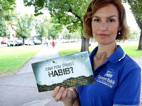 Liberal candidate Carolyn Habib holding the offending Labor leaflet at the 2014 SA election.