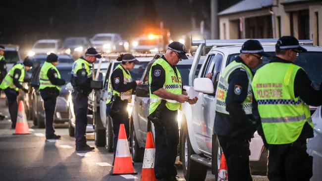 Police question drivers at a checkpoint in Albury on the NSW-Victoria border on Wednesday. Picture: Getty Images