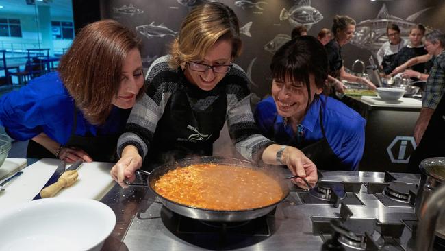 Students enjoy a cooking class at the Sydney Seafood School at the Sydney Fish Market in Pyrmont.