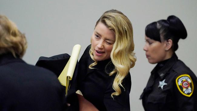 Heard, pictured in court winking at her lawyer, is being sued over her 2018 op-ed. Picture: Steve Helber/Pool/AFP