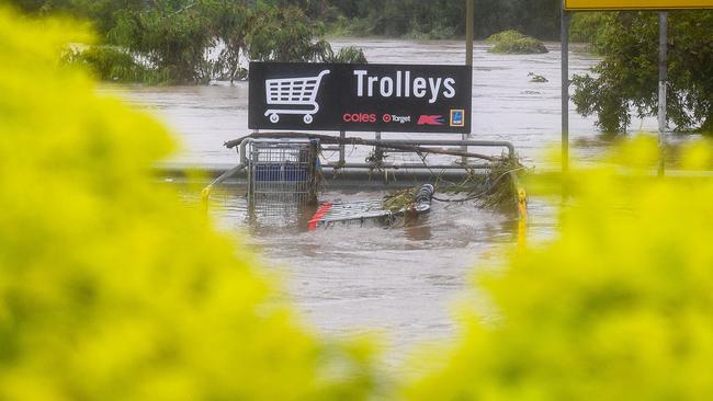 Trolleys at the Toombul Shopping Centre car park in a flood in 2017. The site was ruined in the February, 2022 deluge. Picture:AAP/Albert Perez