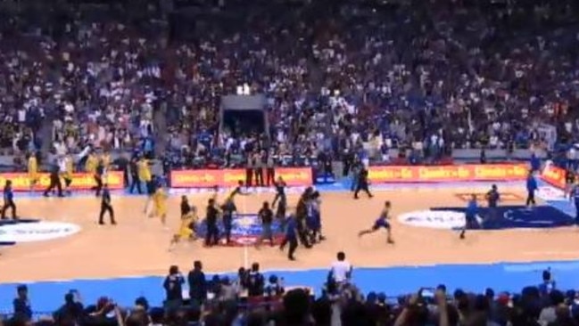 Players and officials from both sides race back down the court when they realise they brawl is not over and Goulding is surrounded by opposition players and officials.