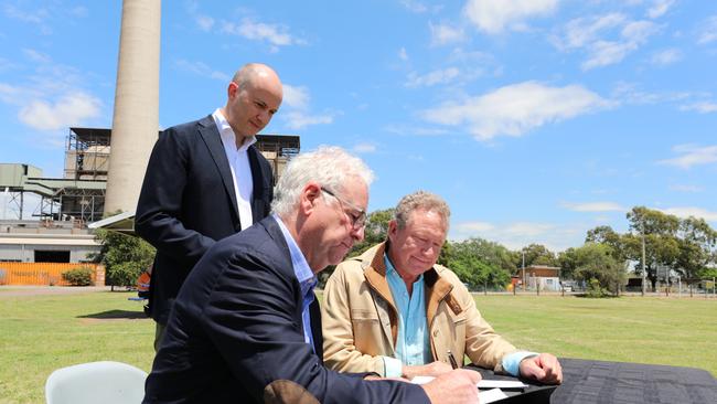 NSW Treasurer and Minister for Energy and Environment, Matt Kean oversees the signing of the Memorandum of Understanding between AGL Managing Director and Chief Executive Officer, Graeme Hunt, and Fortescue Future Industries Chairman, Dr Andrew Forrest on Wednesday. Supplied.