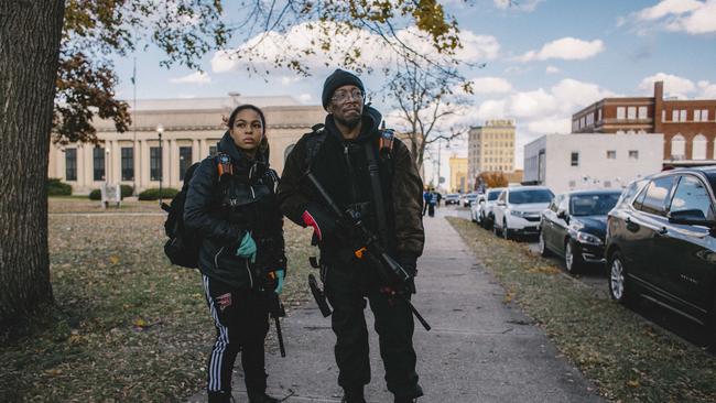 Erick and Jade Jordan guard the perimeter of Civic Center Park while activists protest the verdict in the Kyle Rittenhouse trial on November 21, 2021 in Kenosha, Wisconsin. Picture: AFP