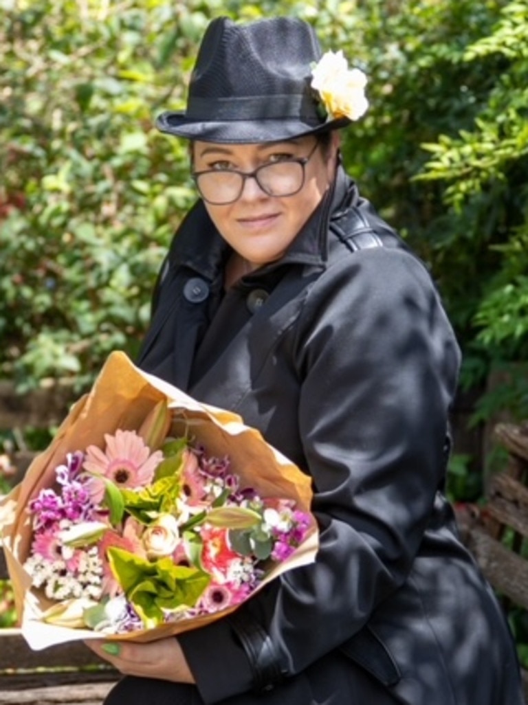 Haley Potter has launched a unique business concept where she dresses up as a secret agent and delivers flowers to residents across the region. Picture: Paul Pugh from Pandom Images