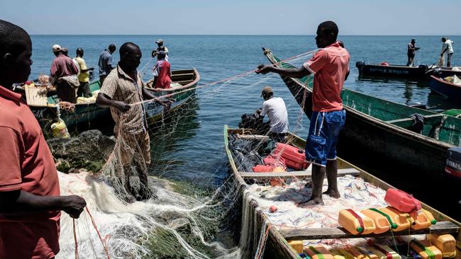 Fishermen preparing their nets on Migingo island that is barely a quarter of a hectare large. Picture: Yasuyoshi Chiba / AFP