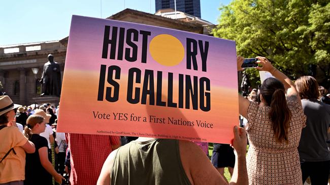 A person holds a placard during a "Walk for Yes" rally for the upcoming voice referendum in Sydney.