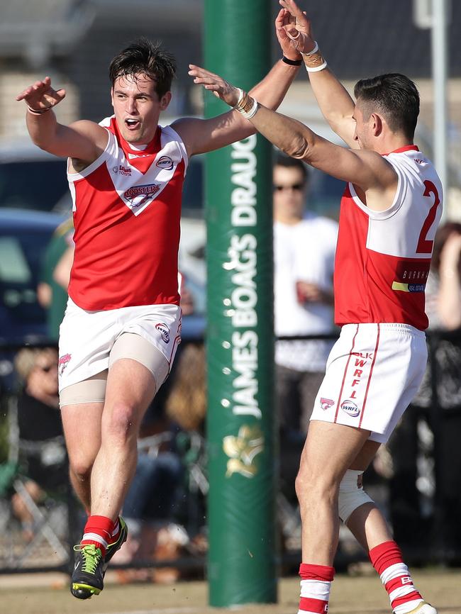 Damien Yze celebrates a goal with teammate Kane Liossis. Picture: Hamish Blair