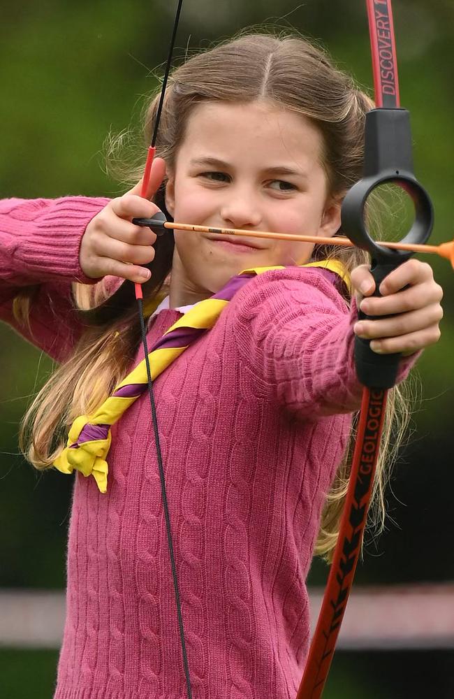 Britain's Princess Charlotte of Wales tries her hand at archery. Picture: Daniel LEAL / POOL / AFP