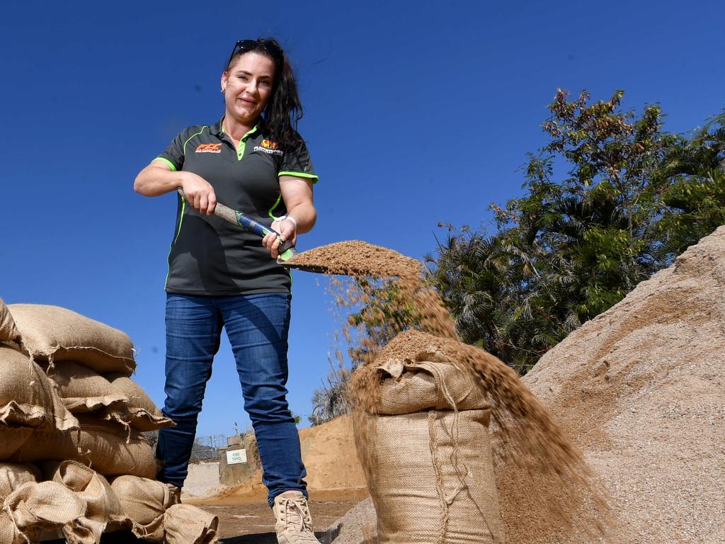 Peta Farrell prepares sandbags ahead of Cyclone Jasper at Flintstones in Townsville. Picture: Evan Morgan