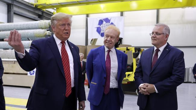 US President Donald Trump speaks as Australian Prime Minister Scott Morrison and Pratt Industries chairman Anthony Pratt, centre, watch during a tour of Pratt Industries. Picture: AP