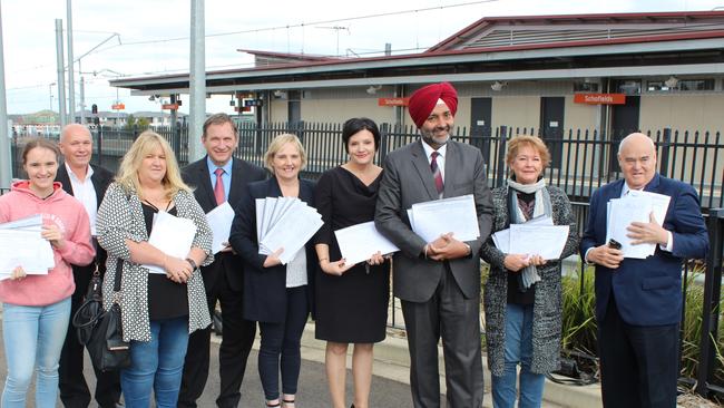 Fourth from left: Stephen Bali, Annemarie Christie, Jodi Mackay, councillor Moninder Singh. Far right is councillor Chris Quilkey. Petition gathers 10, 000 signatures calling for more parking at Schofields train station.