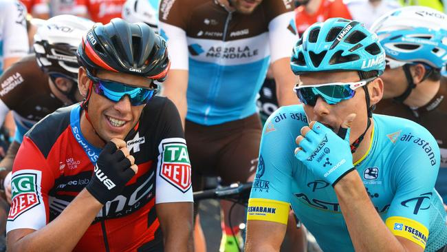 CORRECTION - Richie Porte from BMC Racing and Luis Sanchez Gil (R) from Astana Pro Team look on before the start of the Santos Tour Down Under People's Choice Classic cycling race in the streets of Adelaide on January 14, 2018. / AFP PHOTO / BRENTON EDWARDS / -- IMAGE RESTRICTED TO EDITORIAL USE - STRICTLY NO COMMERCIAL USE -- / “The erroneous mention[s] appearing in the metadata of this photo by BRENTON EDWARDS has been modified in AFP systems in the following manner: {AUSTRALIA] instead of [BAHAMAS]. Please immediately remove the erroneous mention[s] from all your online services and delete it (them) from your servers. If you have been authorized by AFP to distribute it (them) to third parties, please ensure that the same actions are carried out by them. Failure to promptly comply with these instructions will entail liability on your part for any continued or post notification usage. Therefore we thank you very much for all your attention and prompt action. We are sorry for the inconvenience this notification may cause and remain at your disposal for any further information you may require.”