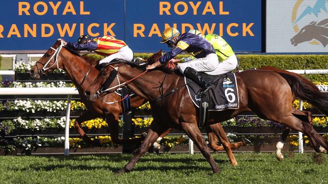 Nature Strip (L), ridden by jockey James McDonald holds off Masked Crusader to win The Everest last year. Picture: David Gray/AFP