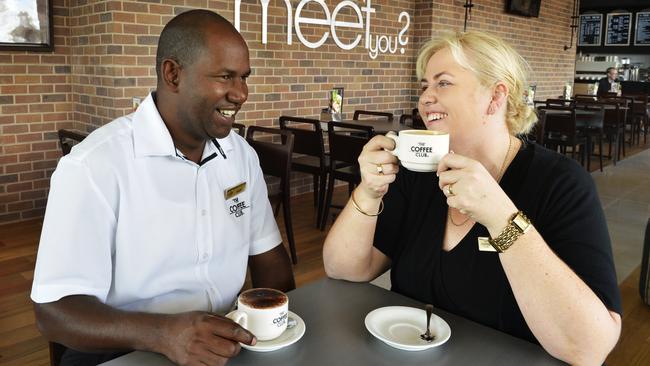 Coffee Club franchisees Boubacar Barry and Angela Holmes-Barry in their Brookwater Village Coffee Club. Picture: Claudia Baxter