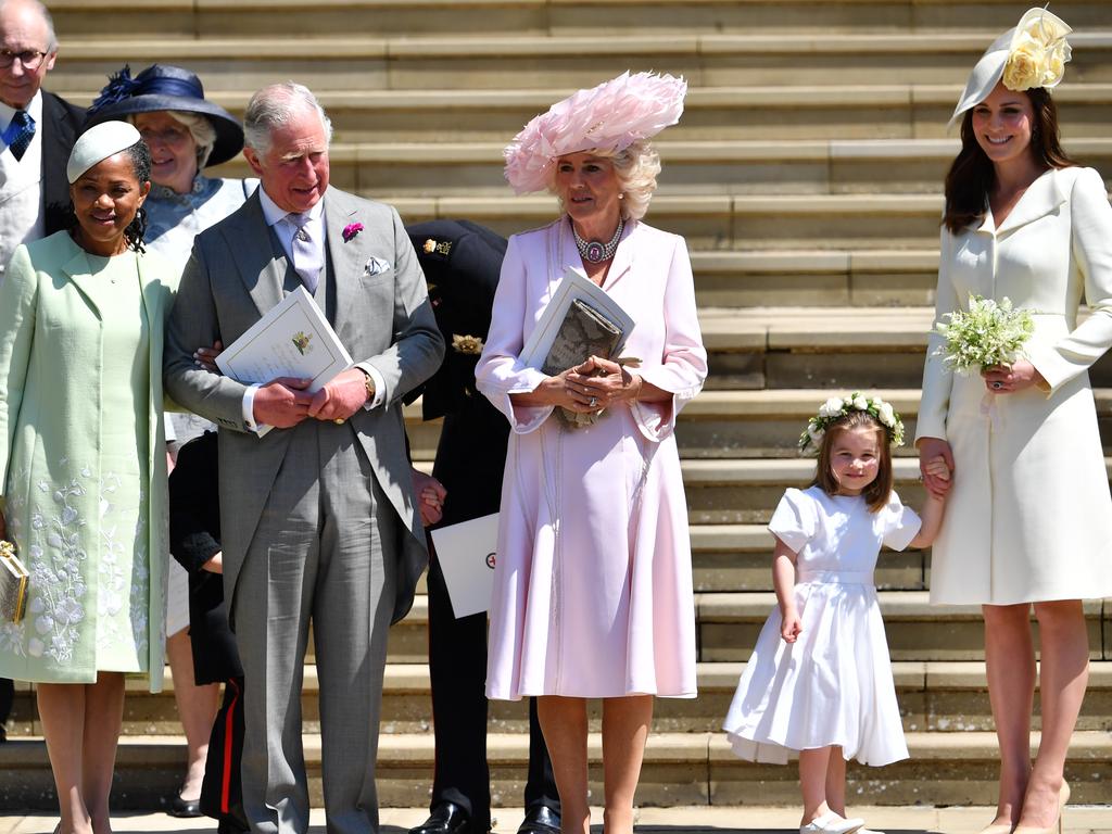 WINDSOR, UNITED KINGDOM - MAY 19:  (L-R) Doria Ragland, Prince Charles, Prince of Wales, Camilla, Duchess of Cornwall, and Catherine, Duchess of Cambridge holding her daughter Princess Charlotte's hand as they leave from the West Door of St George's Chapel, Windsor Castle, in Windsor on May 19, 2018 in Windsor, England. (Photo by  Ben STANSALL - WPA Pool/Getty Images)