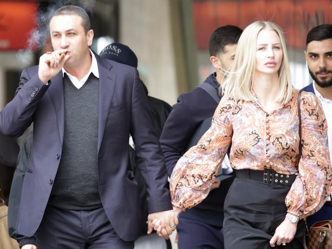 Marwan Haddad and Catherine Le Brocq arrive at Downing Centre Court on Wednesday. Picture: Christian Gilles/NCA NewsWire