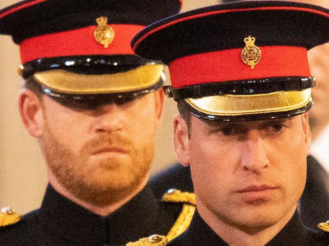 Britain's Prince Harry (L), Duke of Sussex, and Britain's Prince William (R), Prince of Wales arrive to mount a vigil around the coffin of Queen Elizabeth II, draped in the Royal Standard with the Imperial State Crown and the Sovereign's orb and sceptre, lying in state on the catafalque in Westminster Hall, at the Palace of Westminster in London on September 16, 2022, ahead of her funeral on Monday. - Queen Elizabeth II will lie in state in Westminster Hall inside the Palace of Westminster, until 0530 GMT on September 19, a few hours before her funeral, with huge queues expected to file past her coffin to pay their respects. (Photo by Ian Vogler / POOL / AFP)