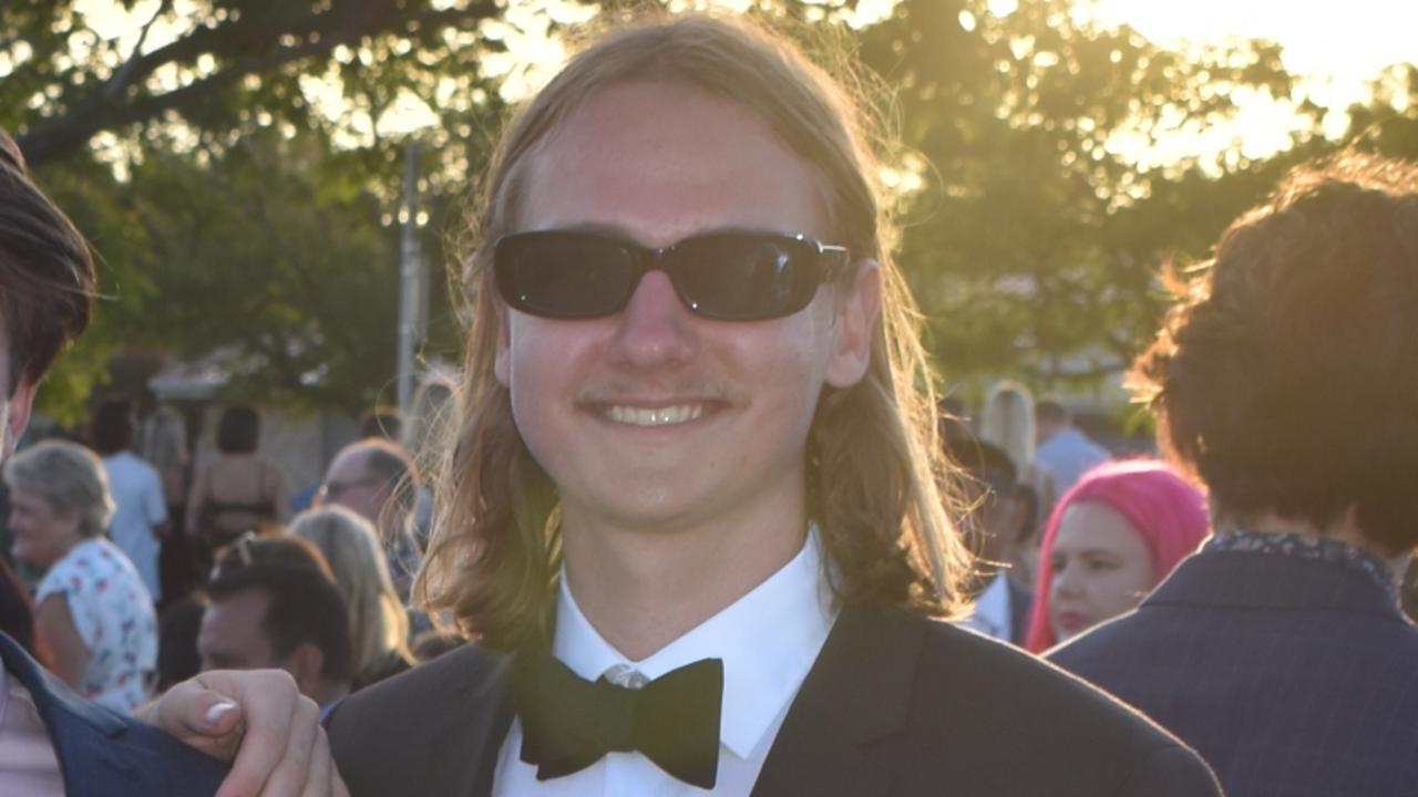 The fast sunglasses and mullet combination by Calel Wright at the Year 12 Mountain Creek State High School formal is a look we approve of. Picture: Eddie Franklin