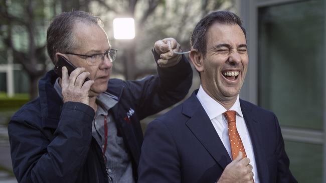 Treasurer Jim Chalmers gets wired-up for TV on Wednesday. Picture: NCA NewsWire / Gary Ramage