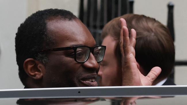 Britain's dismissed Chancellor of the Exchequer Kwasi Kwarteng gets into a car outside Number 11 Downing Street.