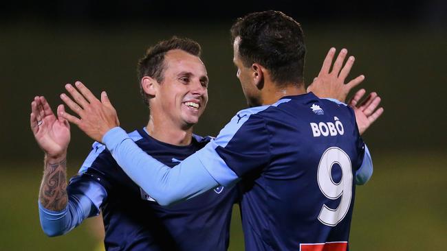 Bobo and Luke Wilkshire celebrate after wrapping it up. (Jason McCawley/Getty Images)
