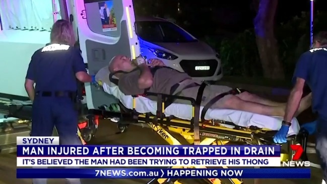 Man gets stuck in Sydney drain trying to pick up thong (7 News)