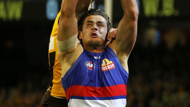 Tom Boyd goes for a mark against the Hawks. Picture: George Salpigtidis