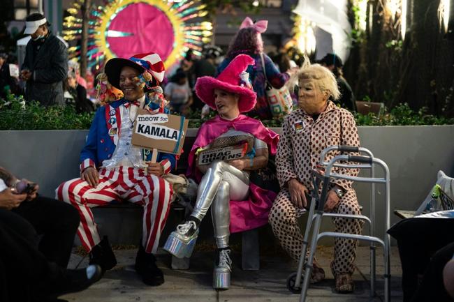 Attracting as many as 60,000 people, the parade saw fancy dress revellers, many of whom wore costumes pillorying prominent politicians, process up Sixth Avenue