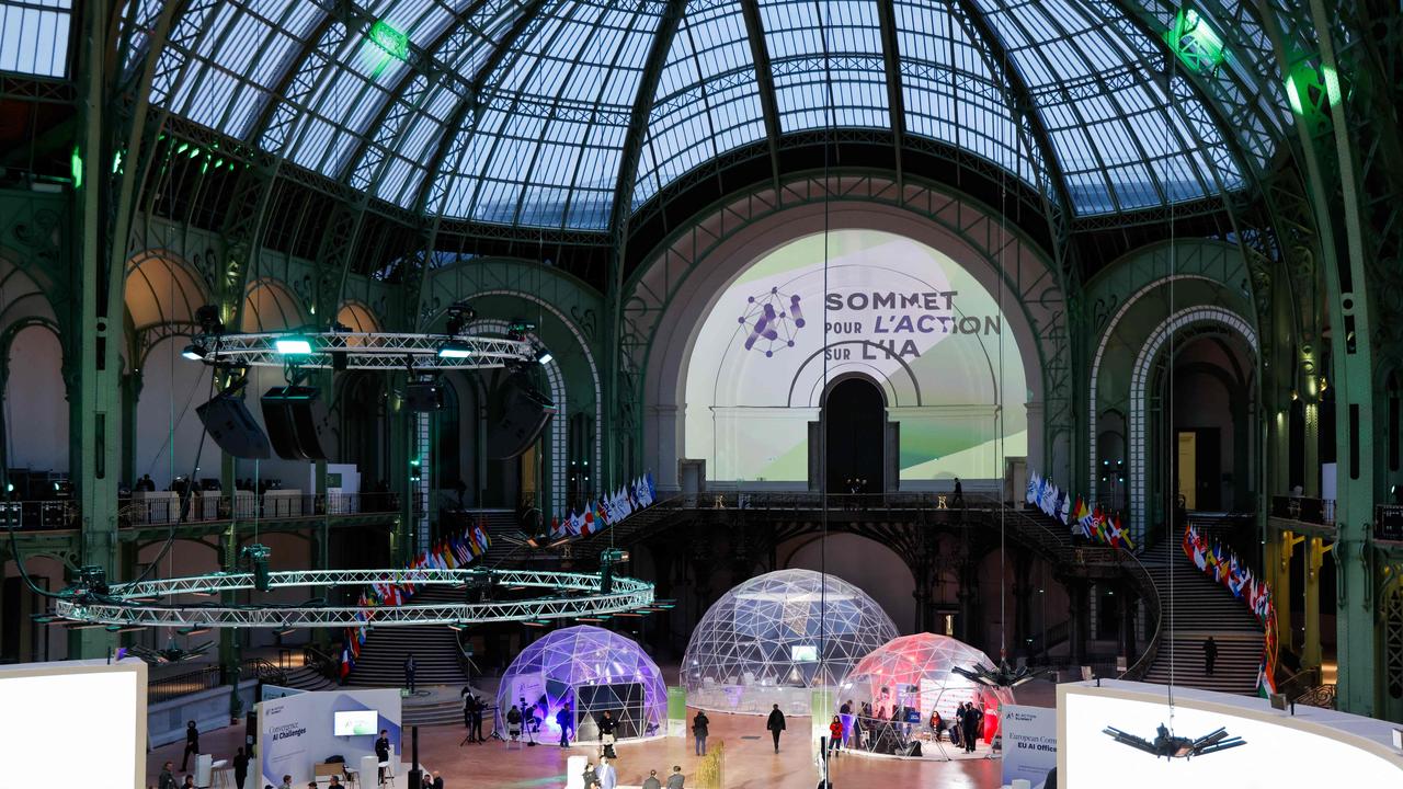 Delegates and exhibitors arrive to take part in the Artificial Intelligence (AI) Action Summit, at the Grand Palais in Paris on February 10. Picture: Ludovic Marin/AFP