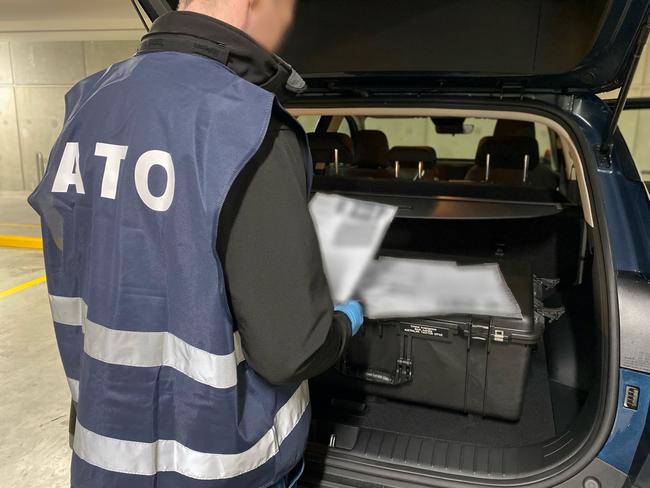 Australian Taxation Office investigators conducting raids on six individuals in Adelaide in connection with the Operation Protego GST refund scam. Pics - ATO