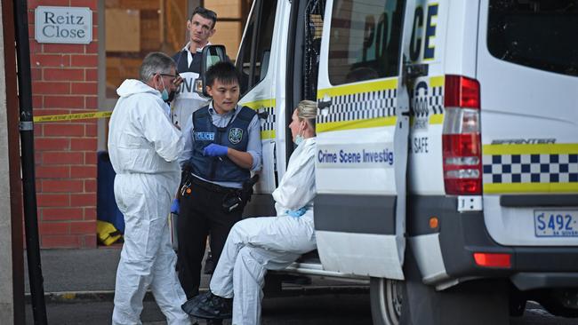 Police at the scene on Tuesday evening after a man’s body was found in an apartment building on Sturt Street. Picture: Tom Huntley