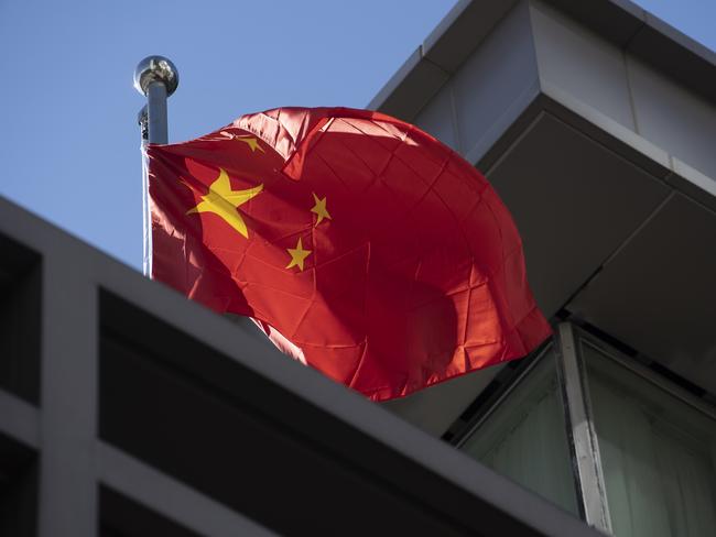 HOUSTON, TX - JULY 22: A Chinese national flag waves at the Chinese consulate after the United States ordered China to close its doors on July 22, 2020 in Houston, Texas. According to the State Department, the U.S. government ordered the closure of the Chinese consulate "in order to protect American intellectual property and Americans' private information."   Go Nakamura/Getty Images/AFP == FOR NEWSPAPERS, INTERNET, TELCOS & TELEVISION USE ONLY ==