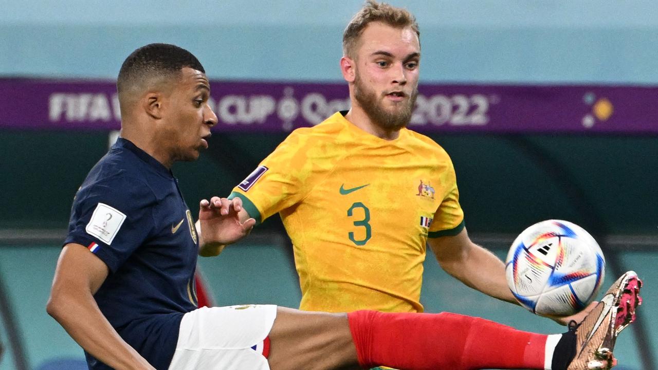 France's forward #10 Kylian Mbappe (L) fights for the ball with Australia's midfielder #03 Nathaniel Atkinson during the Qatar 2022 World Cup Group D football match between France and Australia at the Al-Janoub Stadium in Al-Wakrah, south of Doha on November 22, 2022. (Photo by Chandan KHANNA / AFP)