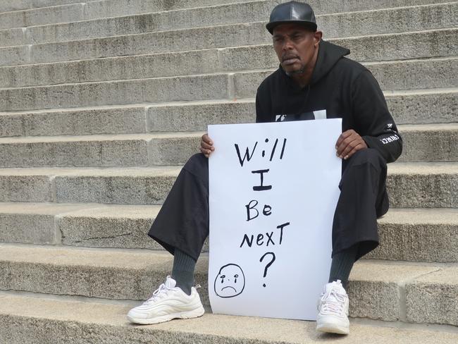 Jesse Spencer, 58, of Topeka, Kansas., sits on the south steps of the Kansas Statehouse during a protest of George Floyd's death. Picture: AP Photo/John Hanna