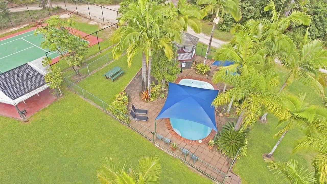 Ferns Hideaway Resort boasts a full size tennis court, wedding ceremony area, beach volley court, sun covered saltwater swimming pool with an eight person relaxation spa, pergola and solar heater. Picture: Contributed