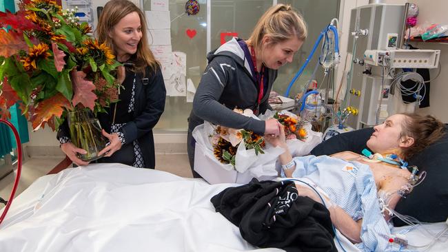 Senior Registrars, Dr Carys Jones and Dr Sandra Stoll bring Toni her wedding flowers. Picture: Jay Town