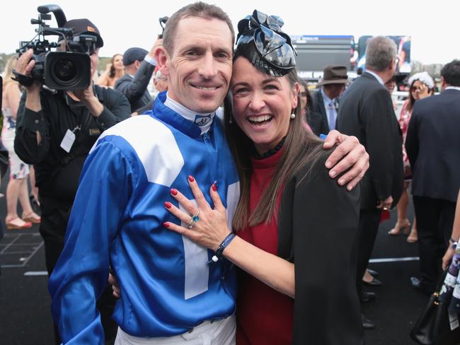 Hugh Bowman with wife Christine after the win. Picture: Getty Images