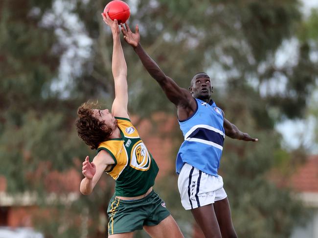 WRFL: The big men fly … Jack Tessari of Wyndhamvale and Kwar Ater of Point Cook Centrals. Picture: George Sal