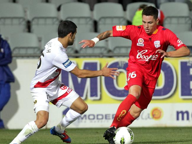 Wooding in action against Melbourne Heart – his only appearance in a Reds shirt.