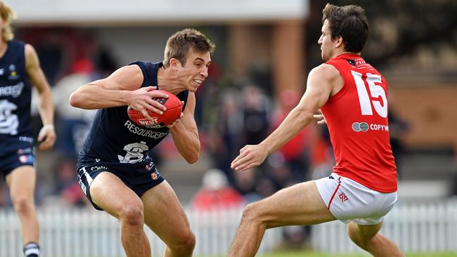 18/05/19 - SANFL: North Adelaide v South Adelaide at Prospect Oval.  Souths' Joel Cross takes on Norths' Tom Schwarz. Picture: Tom Huntley