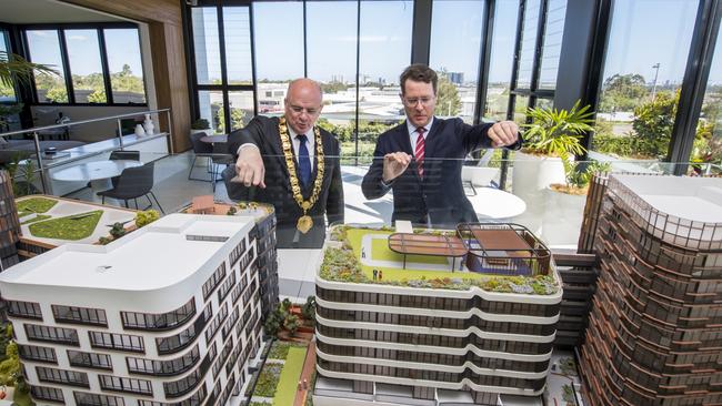 Parramatta Lord Mayor Andrew Wilson and PAYCE director Dominic Sullivan inspect a model of Melrose Park on site.