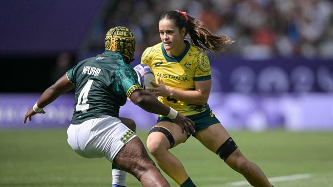 Australia's Dominique Du Toit takes on South Africa's Zintle Mpupha. Picture: AFP